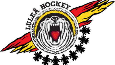 En vit tiger ryter. En kan se dess stora tänder och röda tunga. Tigern är en i en cirkel och runt cirkeln syns fägerna rött, svart och gult.